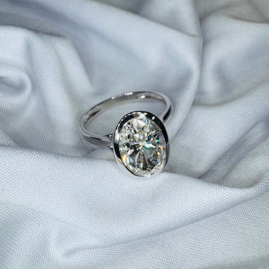 Oval diamond ring in a sculptural setting